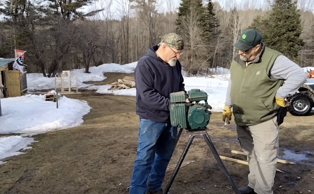 Two-Brothers-Looking-at-Stake-Sharpener